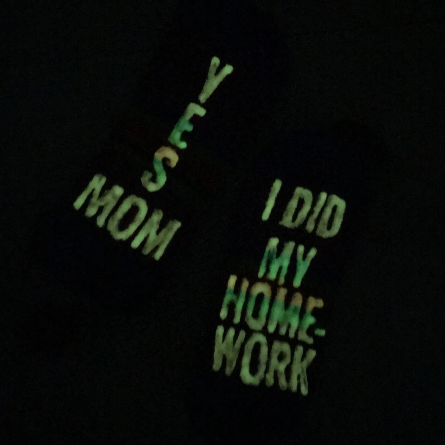glow in the dark socks made with the freezer paper stencil method.