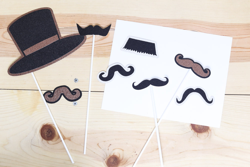 Mustaches photo props in different colors made with Cricut