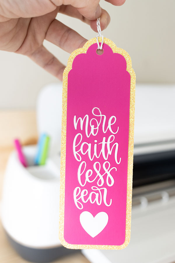 More faith less fear bookmark made with Cricut Iron-on and pink and yellow cardstock.